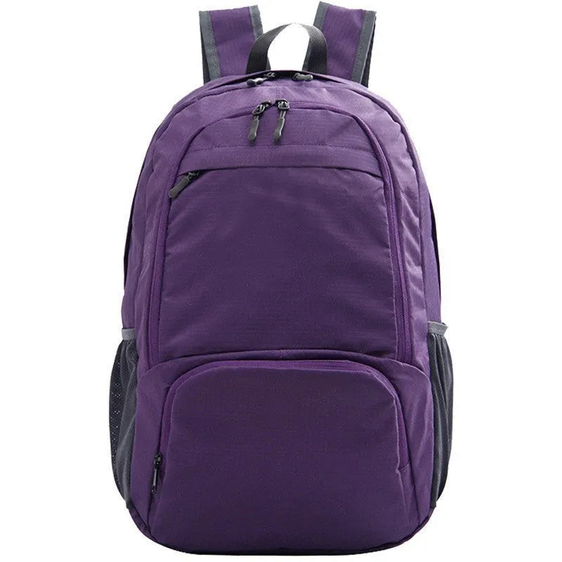 26 inch solid colour foldable backpack in Oxford cloth shown in black, blue, brick red, grey, green, orange, and purple.