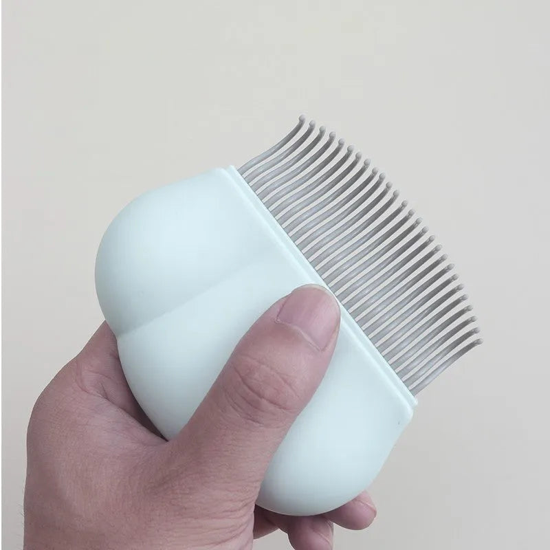 Paw Soft deshedding brush for pets in blue, pink, or white on a white background.