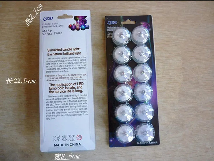 LED waterproof electronic candle light in seven colours, 3cm diameter, 2.6cm height, plastic body, 12-pack