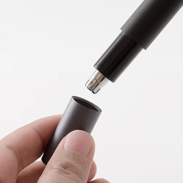 Black electric nose hair trimmer with battery power, fully washable ABS construction, for men and women