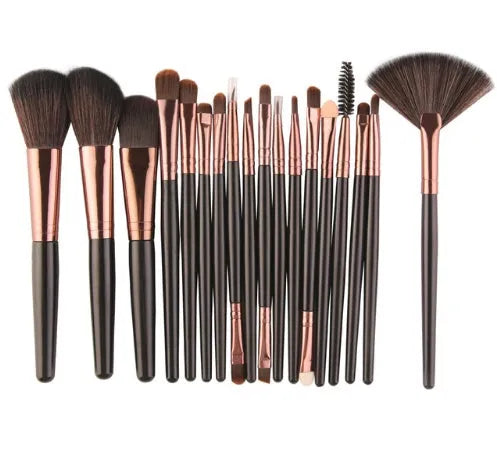 MAANGE 18-piece makeup brush and tool set with fan brushes laid out.