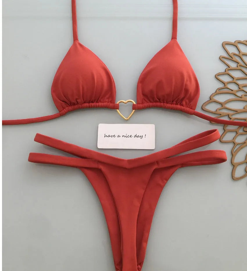 White floral bikini set on display, two-piece briefs style with nylon and spandex fabric