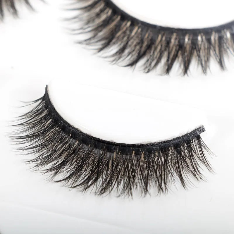 Self-adhesive false eyelashes set with natural curly long section, 0.5cm to 1cm length, on a white tray