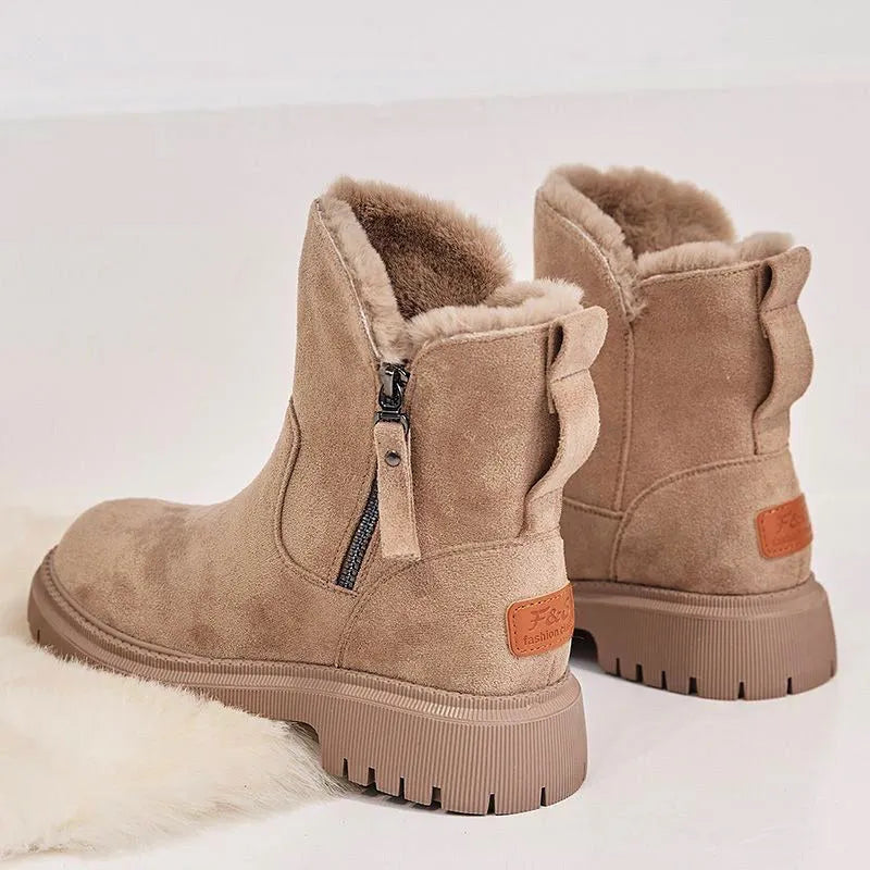 Women's black faux suede high-top snow boots with side zip and thick faux fur lining visible at the ankle.