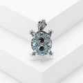 Retro-style alloy turtle brooch with rhinestone decoration, shown in blue colour.