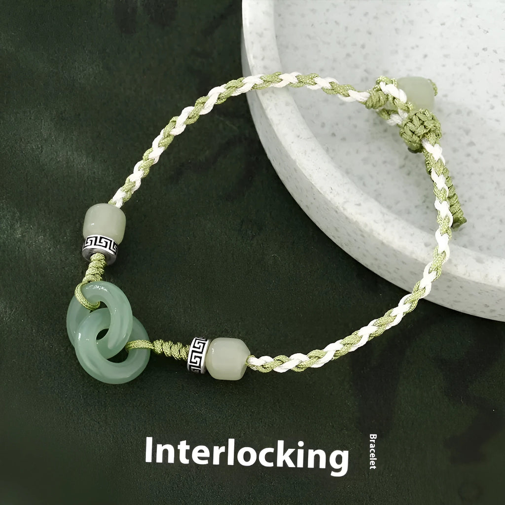 Green adjustable bracelet with jade peace buckle and copper zodiac charm.
