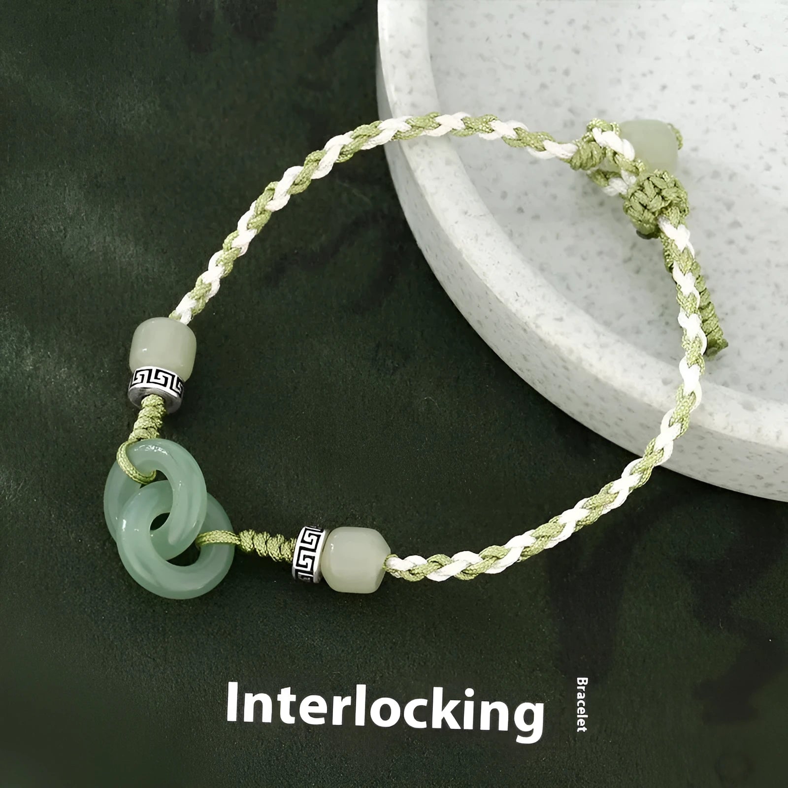 Green adjustable bracelet with jade peace buckle and copper zodiac charm.