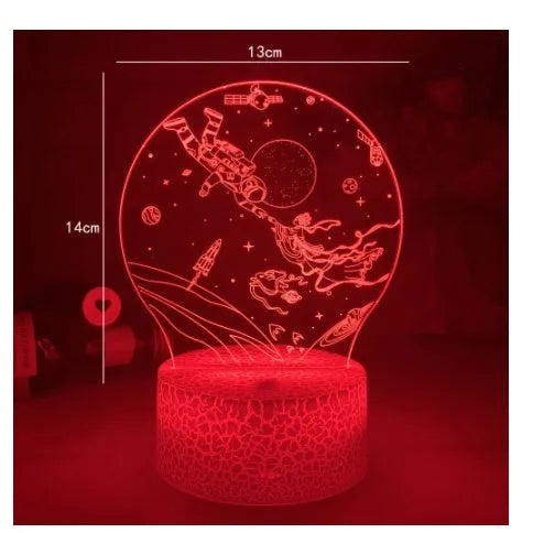 Colourful 3D night light in black base with remote control showing green glow on dark surface