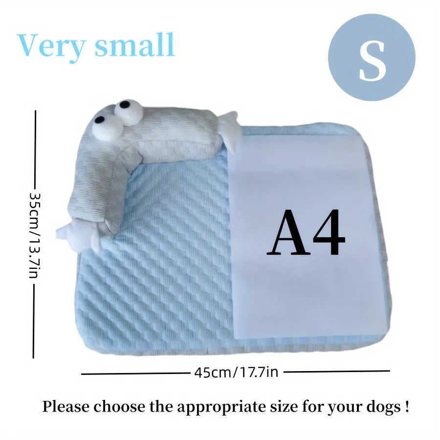 Blue pet bed cushion with big-eyed monster design for dogs and cats on a wooden floor
