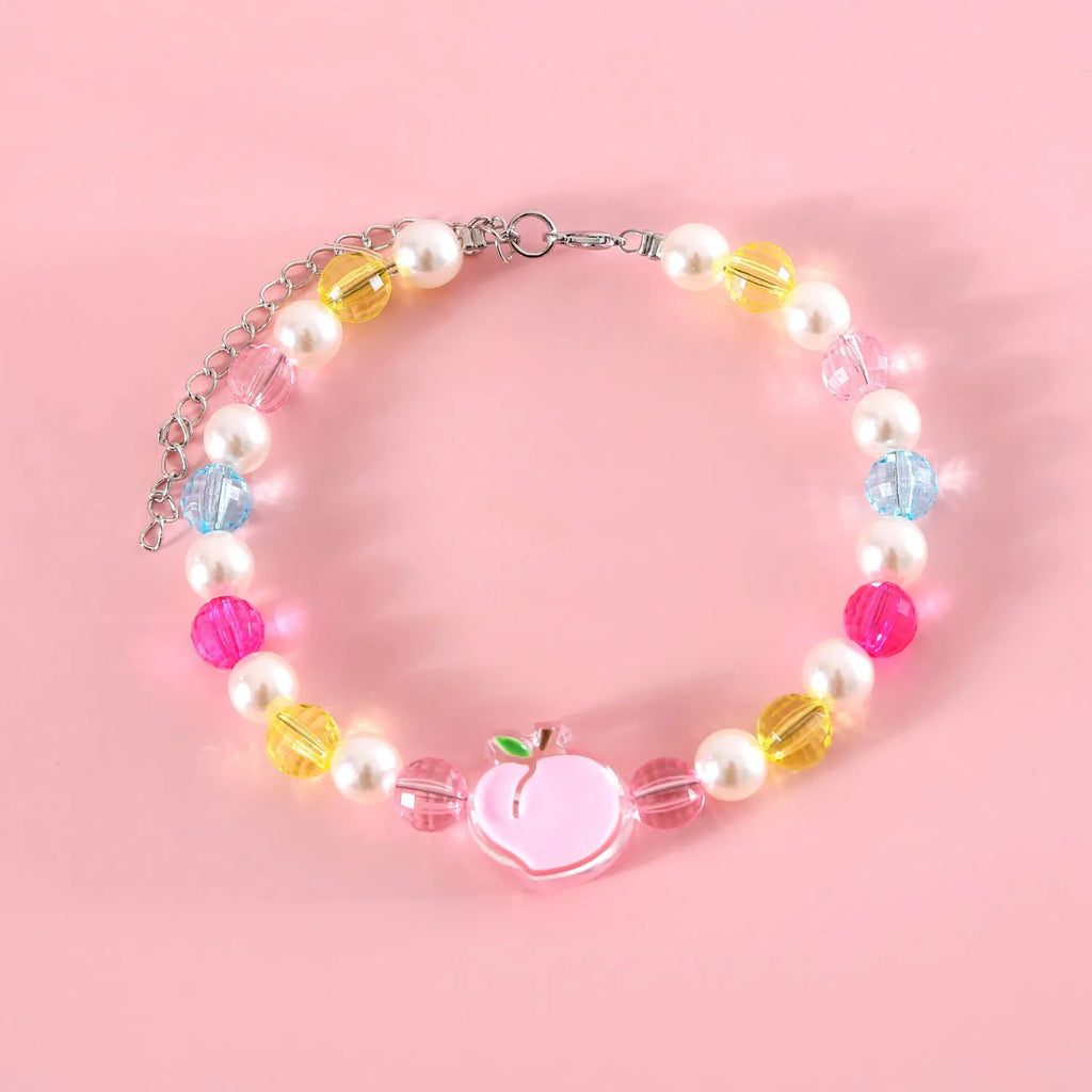 Colourful plastic bead pet necklace for small cats and dogs in peach, rainbow, and small flower designs.