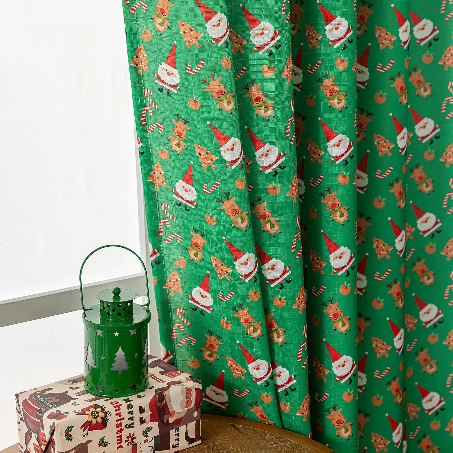 Green Christmas curtain with printed cartoon snowmen and angels, American style.