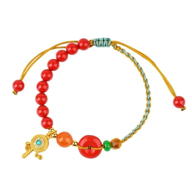 Hand-woven cinnabar peace blessing bracelet with buckle closure in emperor red sand colour