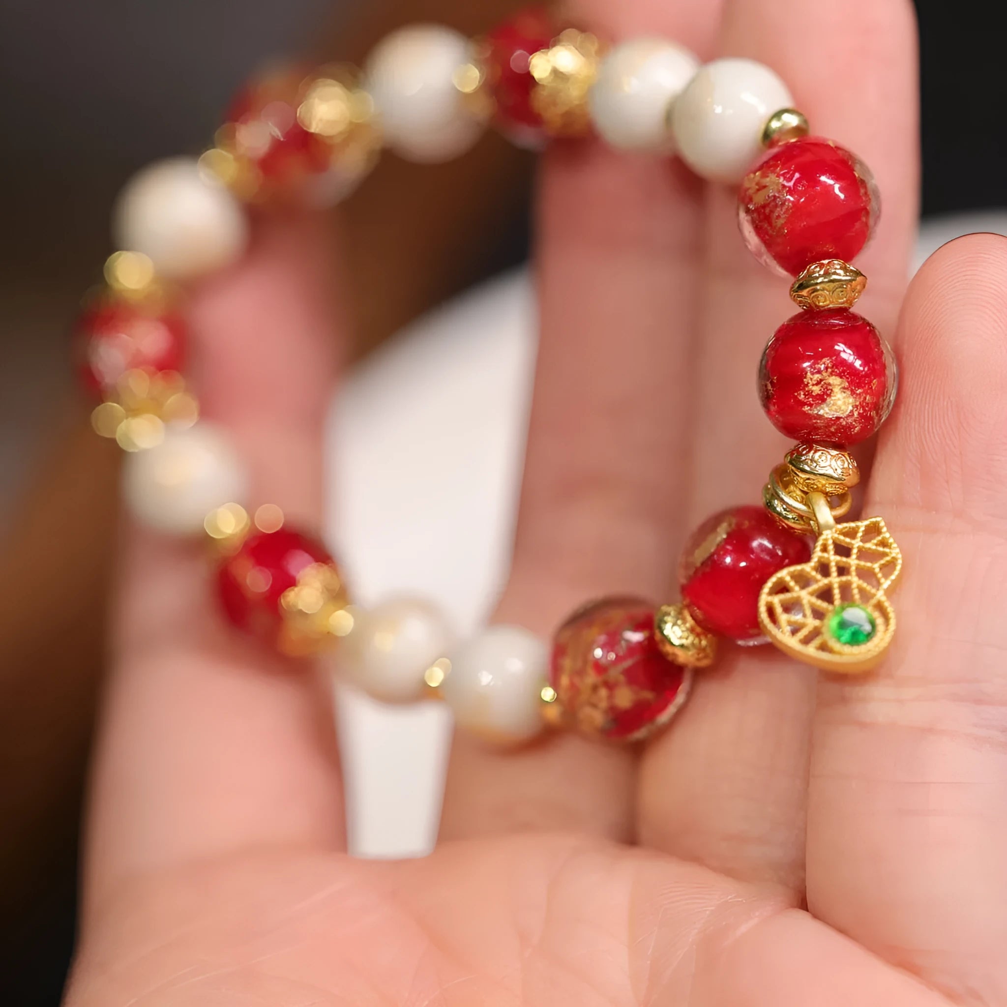 Women's geometric ethnic style bracelet with gold foil coloured glaze and manual glass construction
