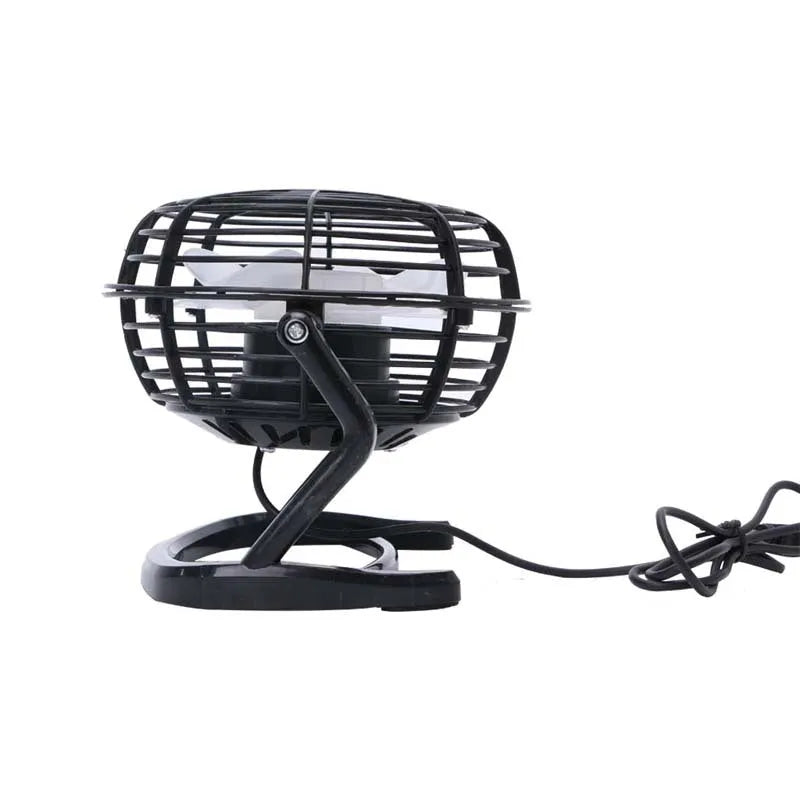 Small black adjustable USB desk fan with key switch on a wooden table.