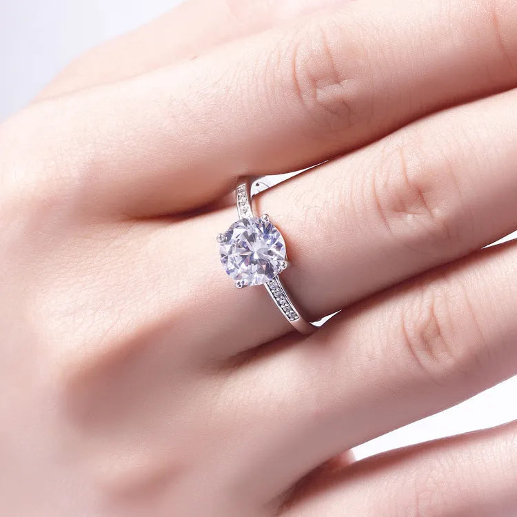 925 sterling silver engagement ring with 7.5mm clear stone on white background