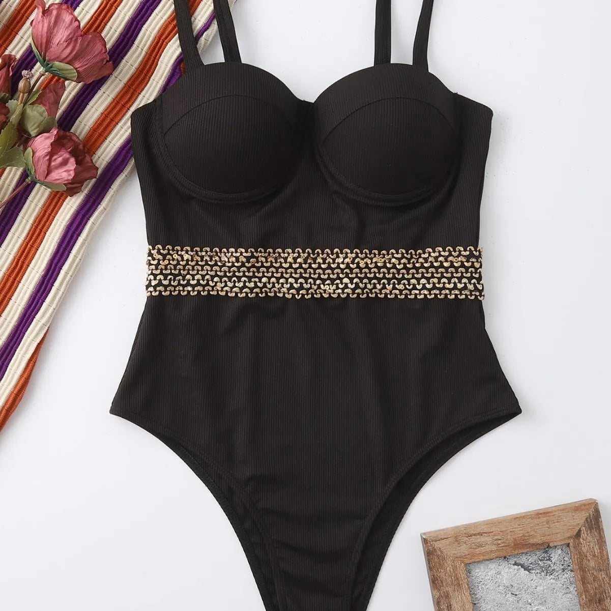 Black women's one-piece swimsuit with a matching hard storage bag that has an adjustable shoulder strap.