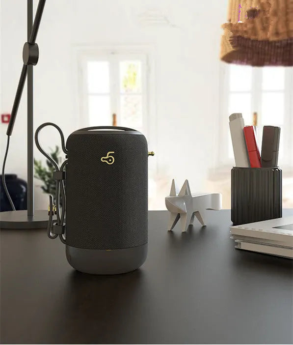 Wireless Bluetooth speaker with black waterproof mesh and leather shell for phone, computer, and car use