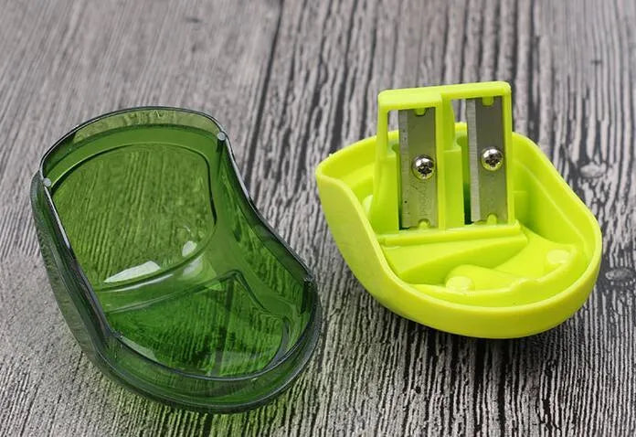 Double hole pencil sharpener for standard and thick pencils in solid closed design