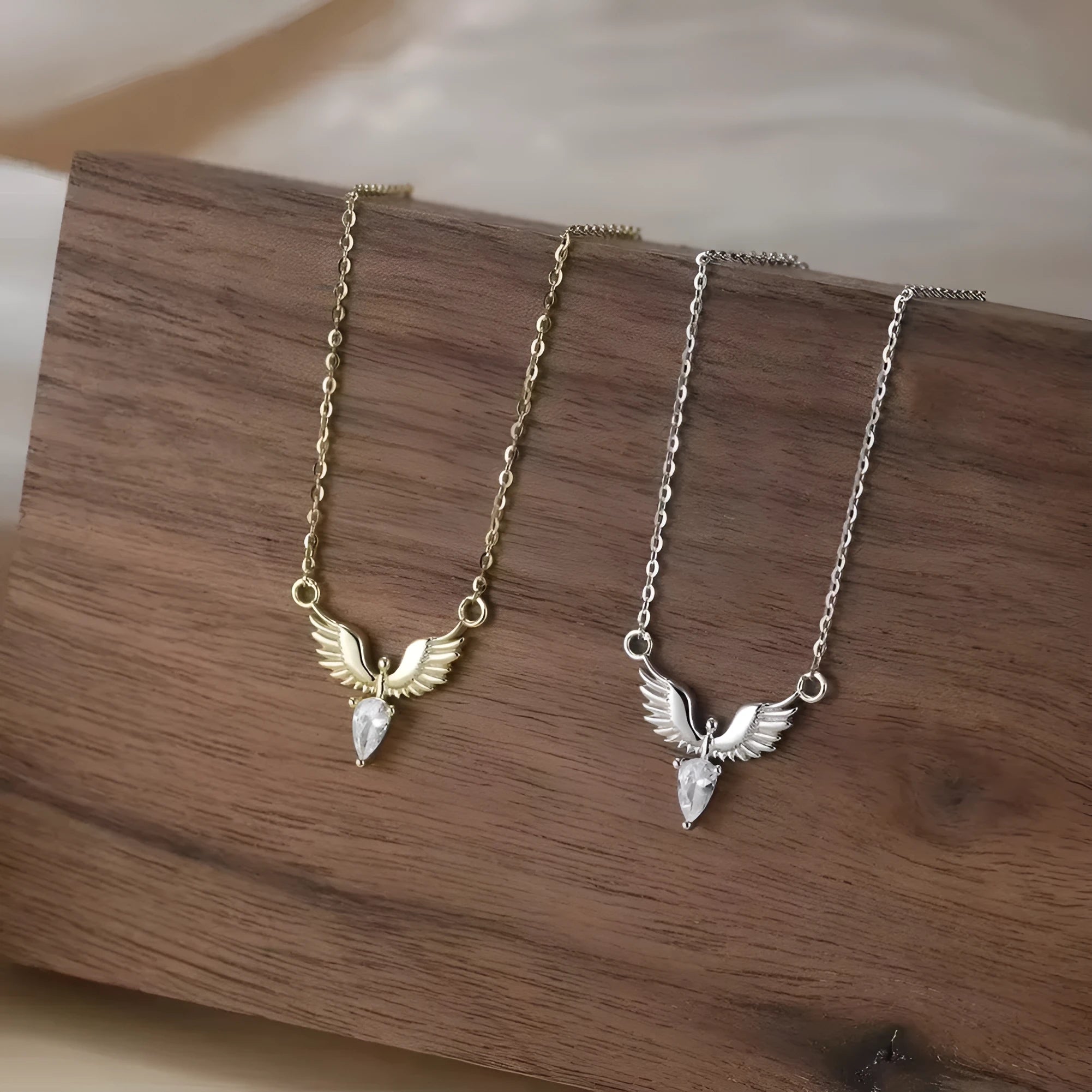 Close-up of a 925 silver eagle pendant on an adjustable O-ring chain necklace with an electroplated finish.
