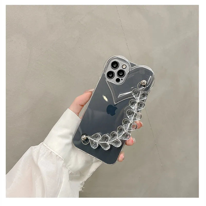 Transparent clear iPhone case with a love heart chain design on a smartphone.