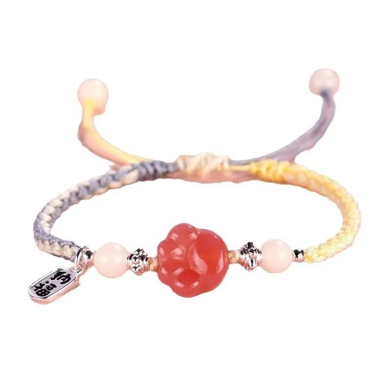 Red glass cat's paw charm bracelet with woven cord in pink or yellow for couples
