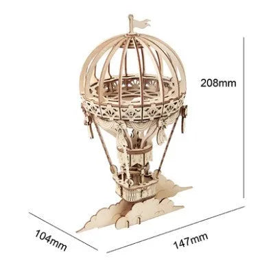 Assembled wooden 3D puzzle model of a Pumpkin Carriage on a white surface, laser-cut plywood construction