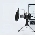 Black condenser microphone on adjustable aluminium stand with USB and 3.5mm cables for computer and mobile streaming