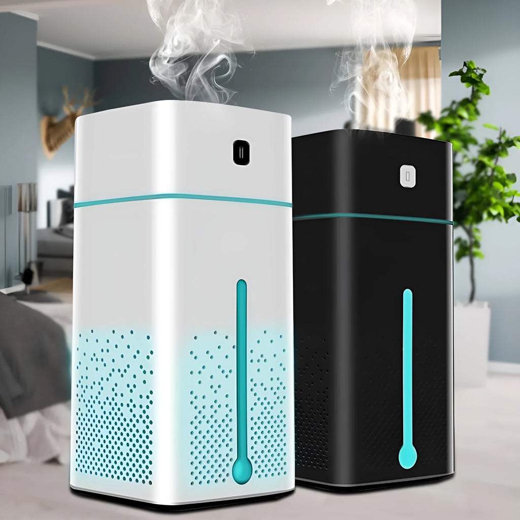 Black or white desktop ultrasonic humidifier with 1000ml tank and USB cable on a wooden desk.