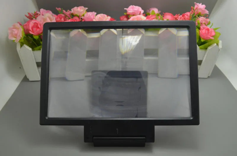 Portable screen amplifier for smartphones with 18cm by 12cm viewing area in black and white colour options