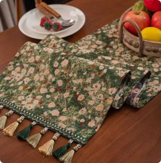 European retro style long table flag with handwoven tassels draped over a wooden sideboard