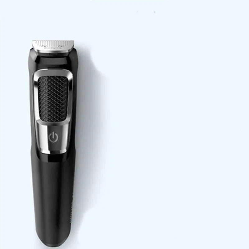 A standard-colour nose and beard hair clipper with a compact design, shown with a cleaning brush.