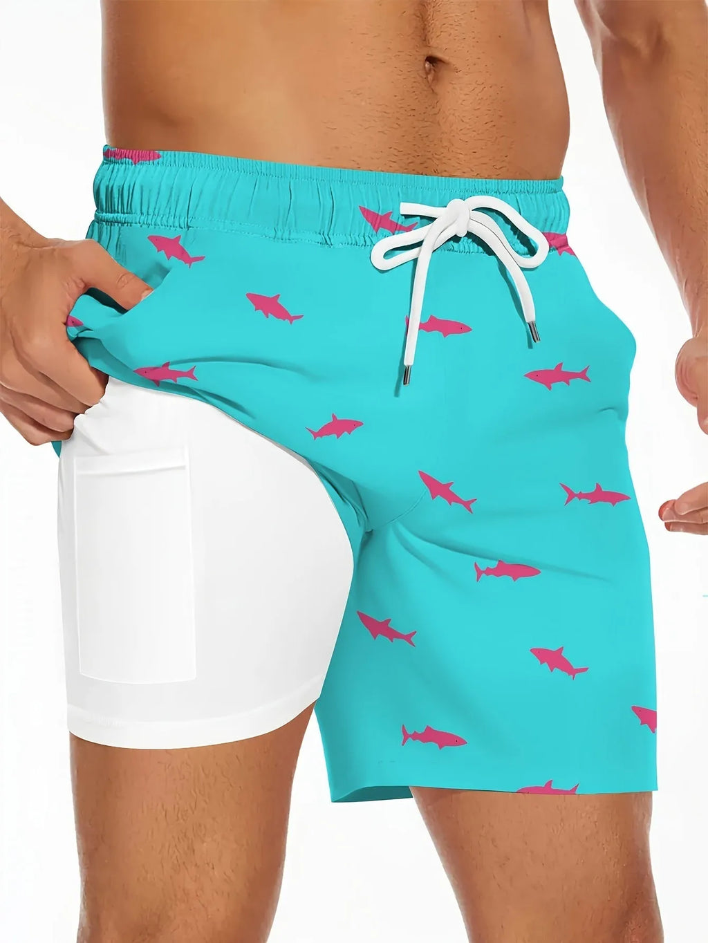 Men's black beach shorts with a white shark graphic print and a white drawstring waistband.