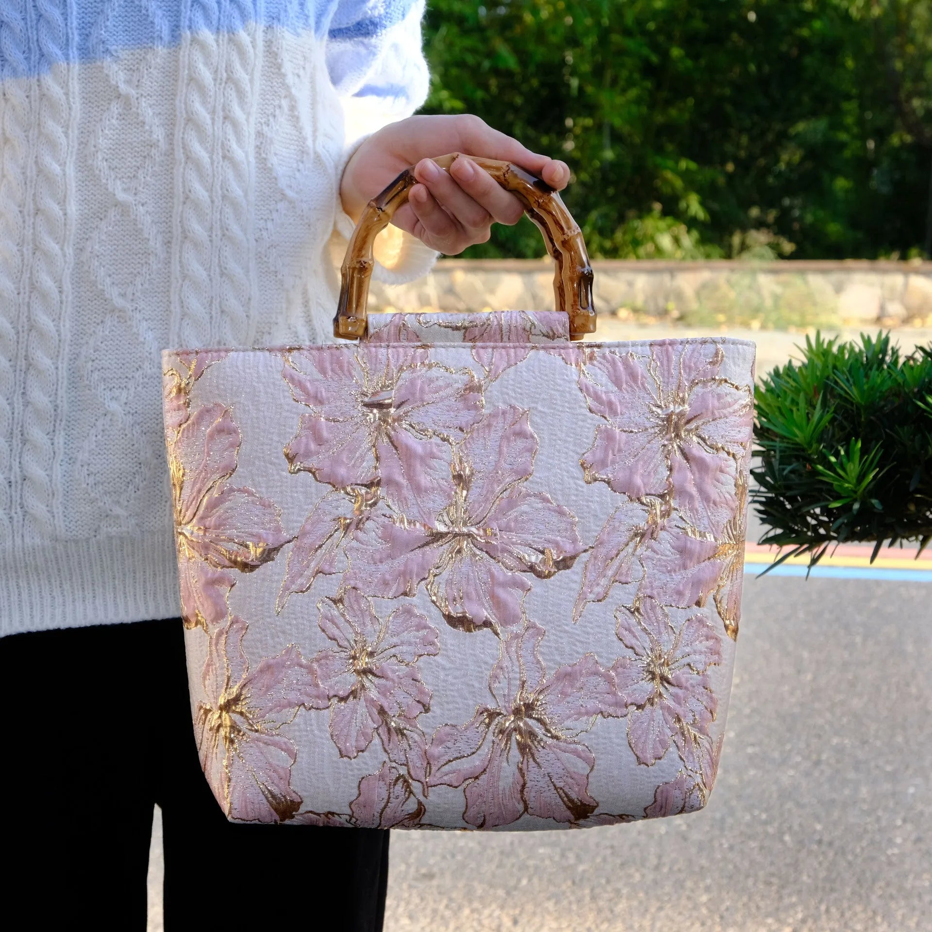 Light blue canvas shoulder bag with gold floral decoration and double shoulder straps