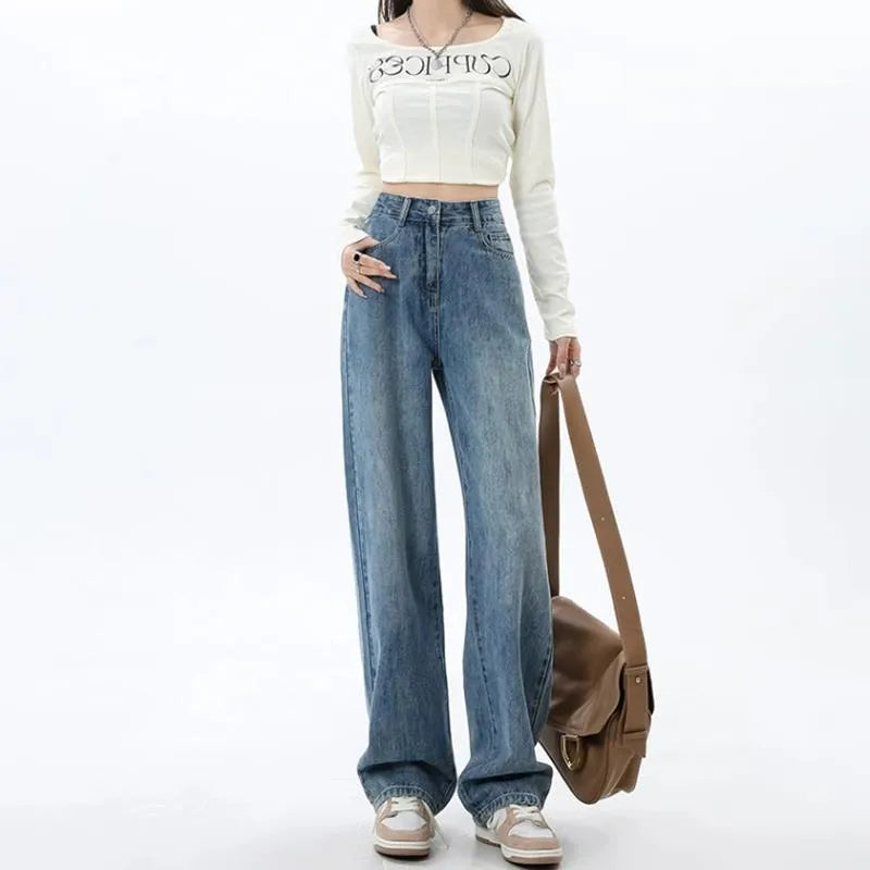 Retro blue women's wide leg jeans with a high waist and straight leg on a hanger