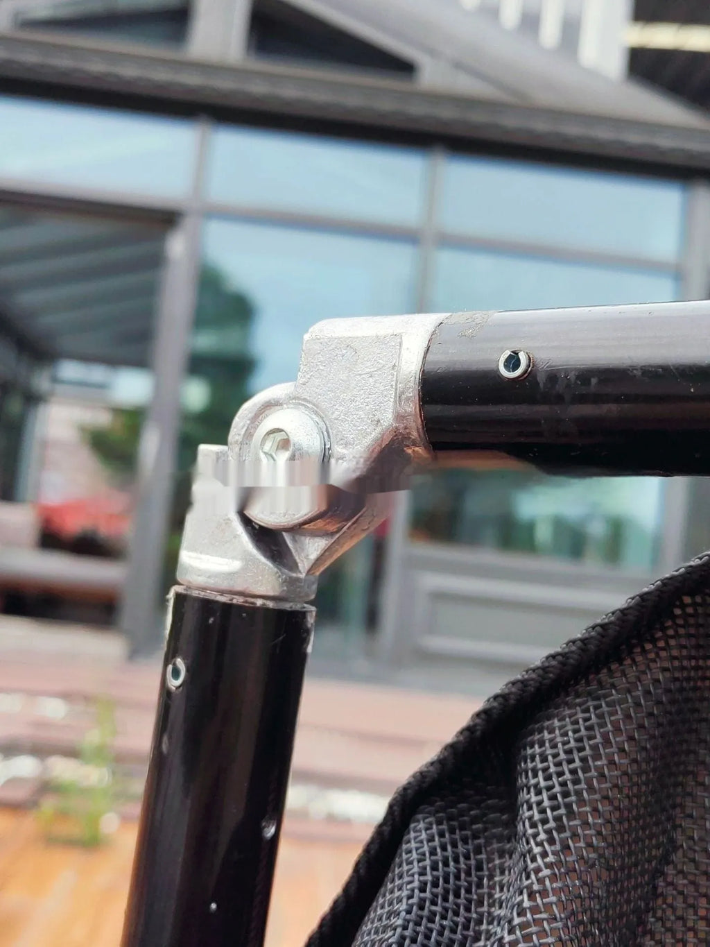 Large black aluminium alloy foldable pet stretcher for emergency dog transport.