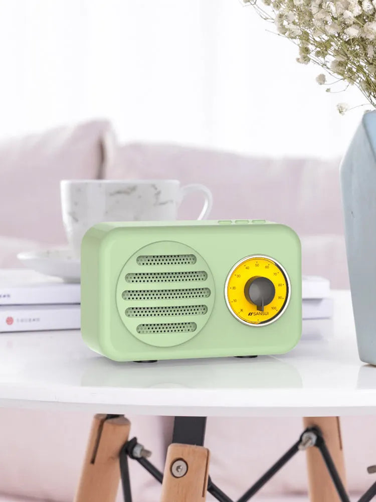Compact portable Bluetooth speaker in wood colour finish with FM radio and USB cable.