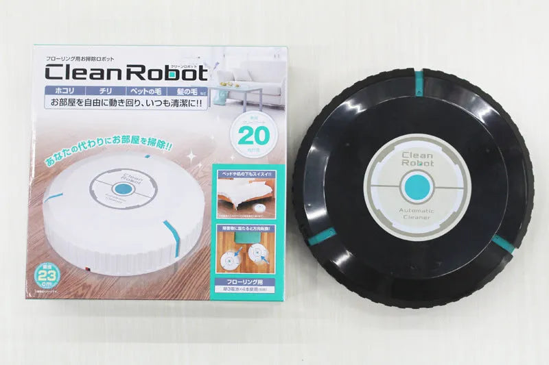 Black automatic robot vacuum cleaner on a wooden floor
