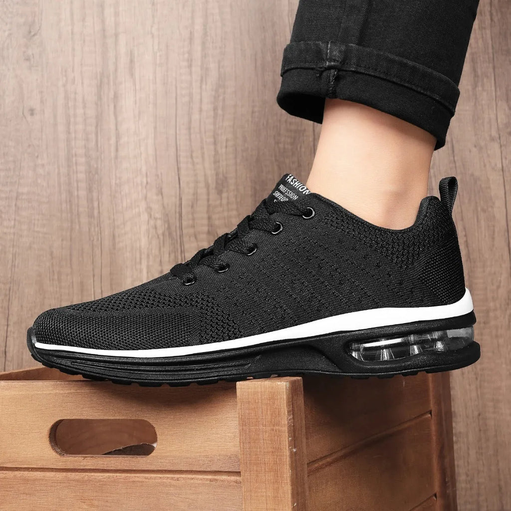 Casual Flyknit running shoes in a colour option, showing mesh upper and round toe design.