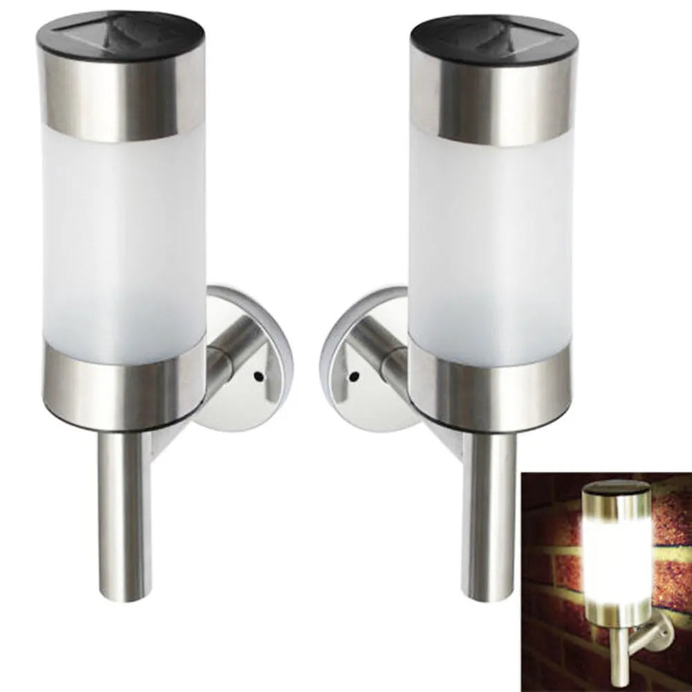 White solar-powered outdoor wall light with solar panel on top, showing compact rectangular design.