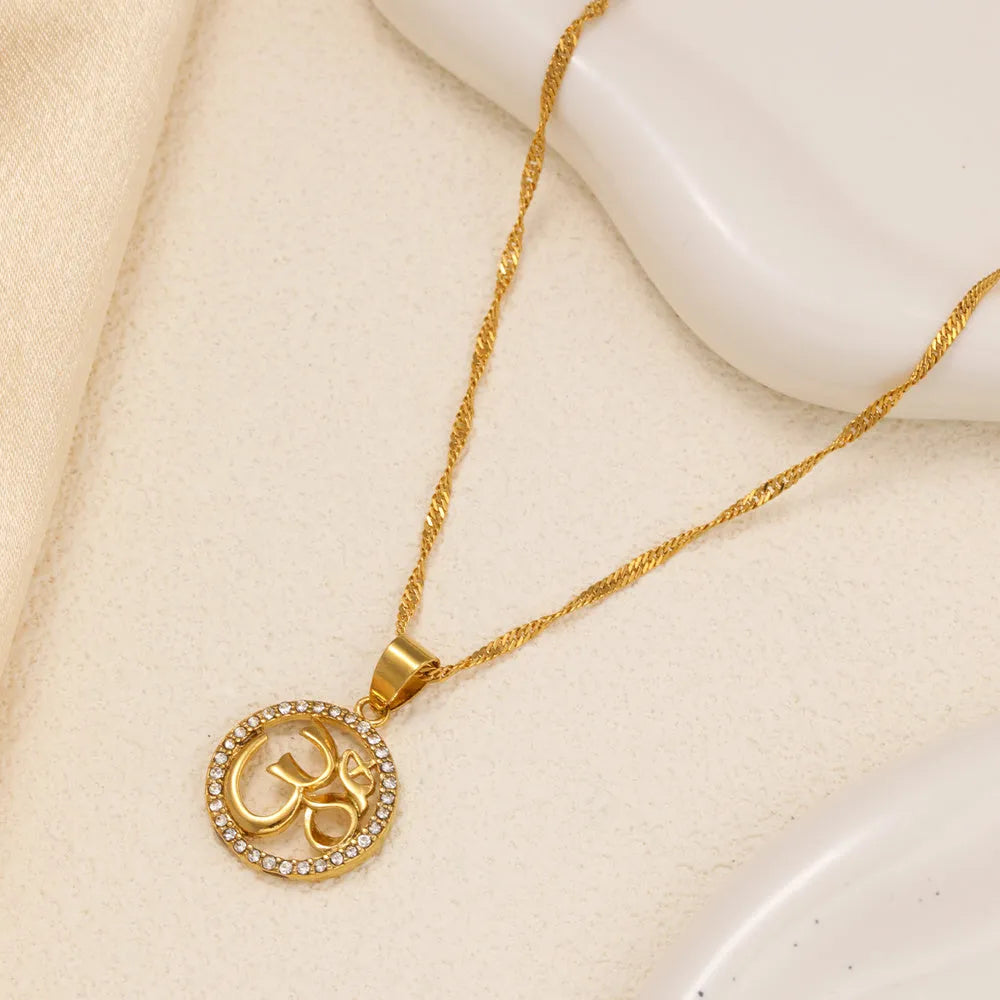 Gold plated copper necklace with circular OM pendant and inlaid stones