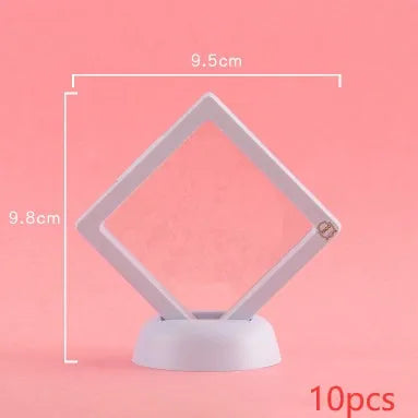 3D floating display case holding coins and jewellery between transparent membrane sheets