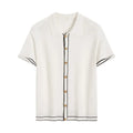 White short-sleeve women's V-neck cardigan with dark contrasting lapels laid flat.