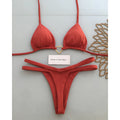 White floral bikini set on display, two-piece briefs style with nylon and spandex fabric