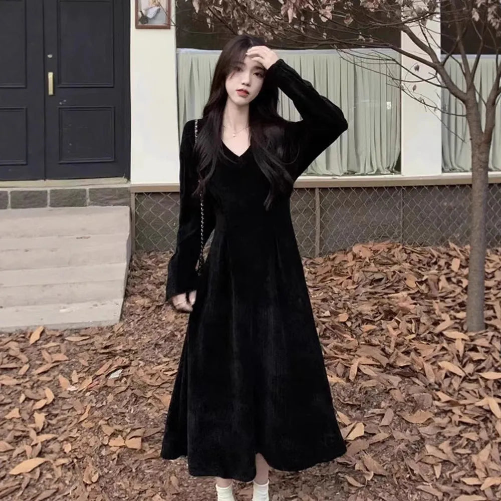 Women's knitted V-neck dress with princess sleeves and long skirt in Milky White or Black.