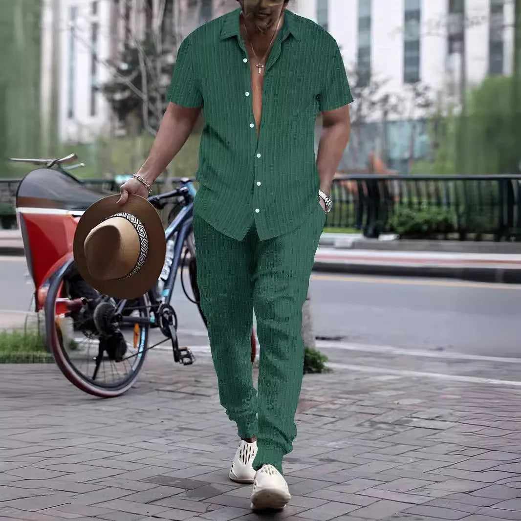 Men's loose fit casual beach suit set in cotton blend fabric, showing short sleeve shirt and trousers.
