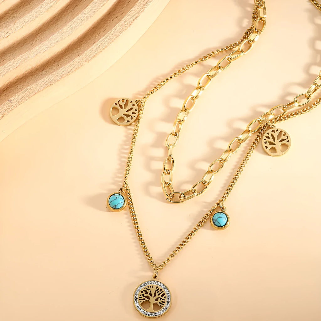 Gold titanium steel multi-layer box chain necklace with turquoise accent on model