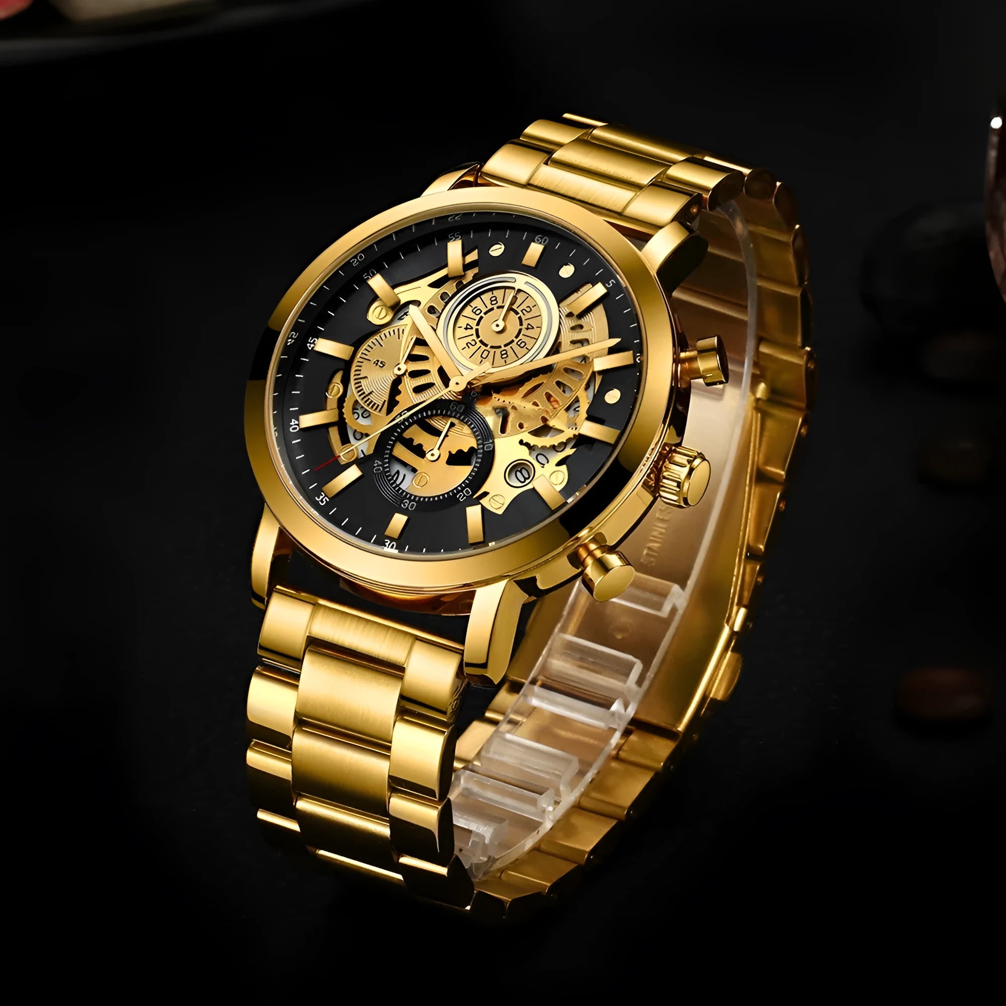 Men's multi-functional calendar watch with hollowed round dial, stainless steel strap, and butterfly buckle on grey background