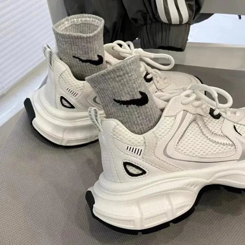Beige mesh platform sports shoes with wedge heel, front lace-up design, and rubber sole