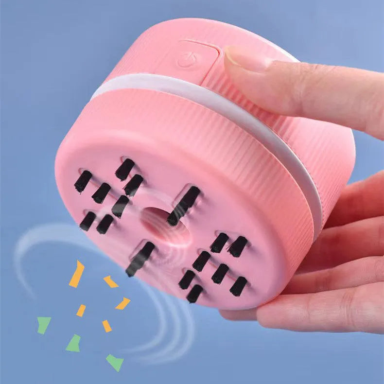 Blue mini desktop vacuum cleaner for pencil eraser chips and keyboard crumbs