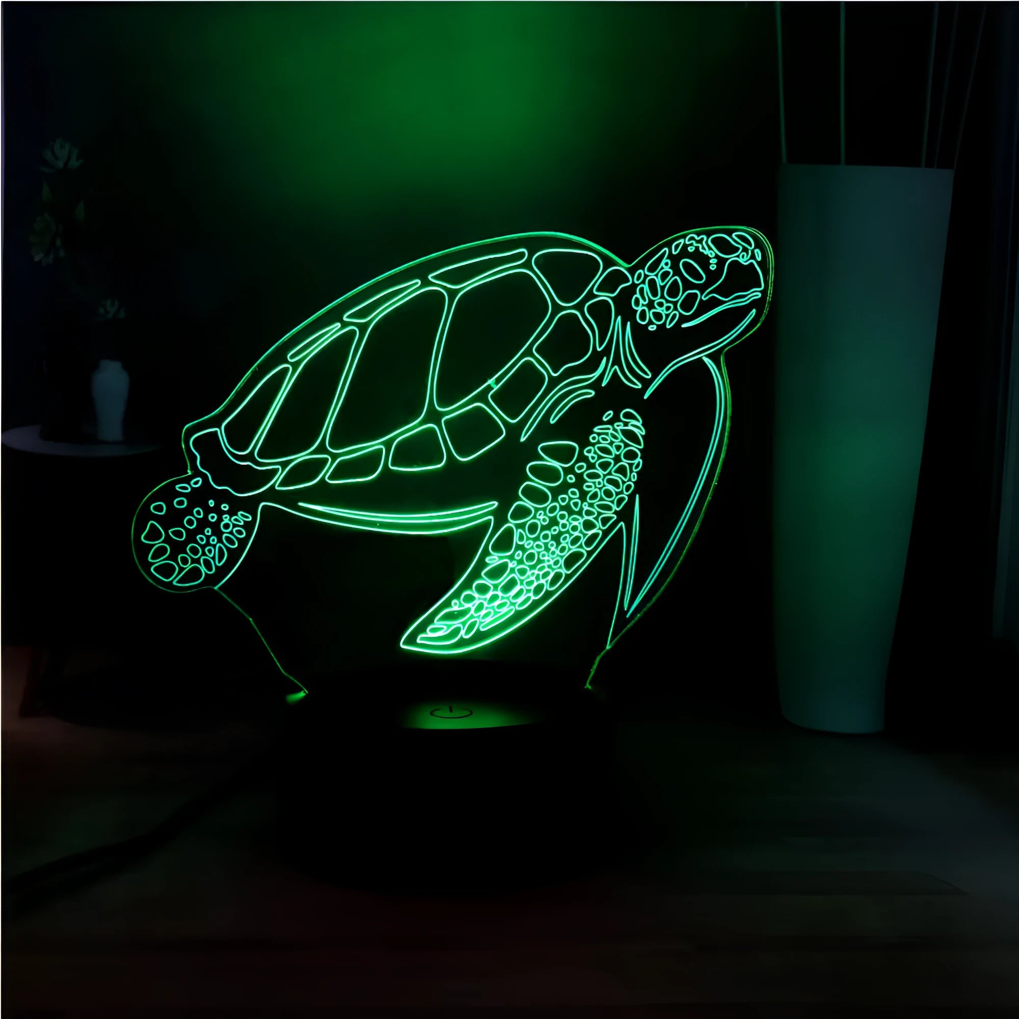 3D acrylic turtle-shaped LED night light glowing in blue, with a remote control.